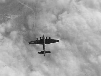 B-17 Flying Fortress Bomber over clouds