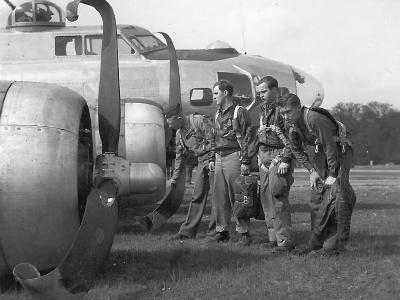 US Airmen looking over their crashed B-17G