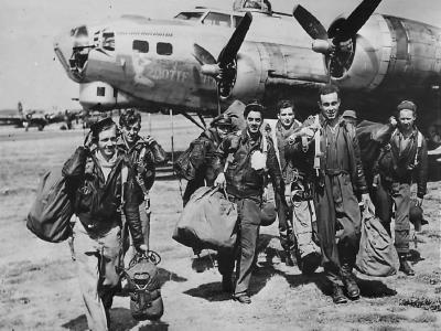 Crewmen of the 91st BG, 401st BS walk from their B-17G