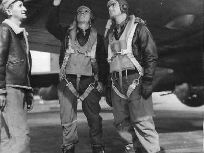 Pilots and Crew Chief check supercharger on B-17