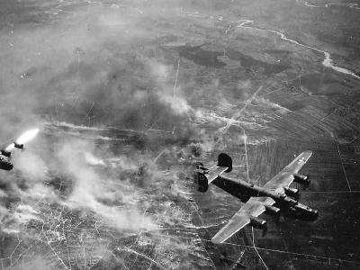 Aerial View of 450th Bomb Group B-24 Bombers Over Burning Target