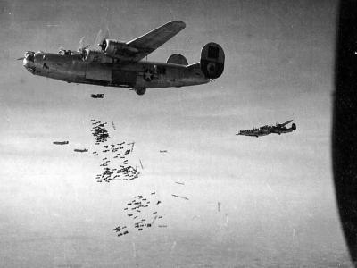 B-24 Liberator of the 460th Bomb Group drops a load of fragmentation bombs on the Aidrome at Neuberg, Austria – 26 March 1945