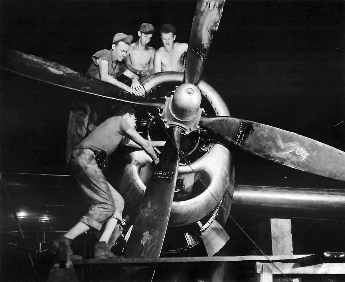 21st BC crew working on engine of B-29 Superfortress. 1945
