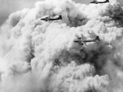 B-29 Superfortress of the 498th BG Formation and Smoke Over Tokyo From Bombs