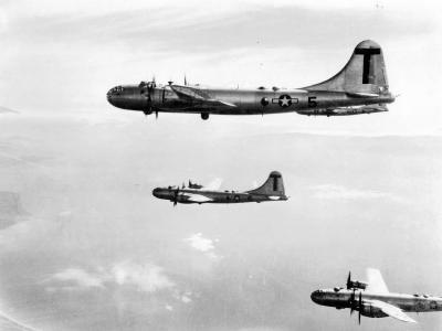 B-29 Superfortress T 5 and 6 from 498th Bomb Group fly into Japan
