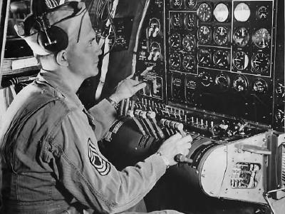 Flight Engineer at instrument panel aboard Boeing B-29