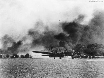 B-17 lands safely as another burns upon return from Schweinfurt 1943