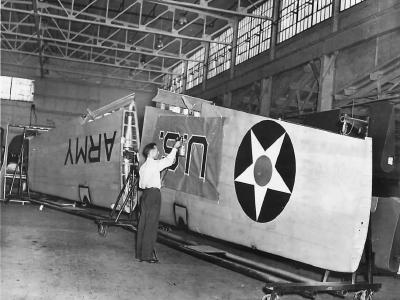 Workman stenciling insignia