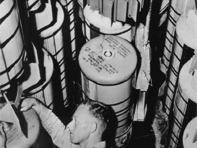 Ordinance Officer sets fuses of B-29 bombs