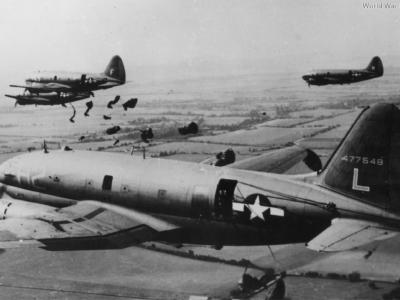 Paratroopers jumping from a C-46 44-77548 313th TCG 2