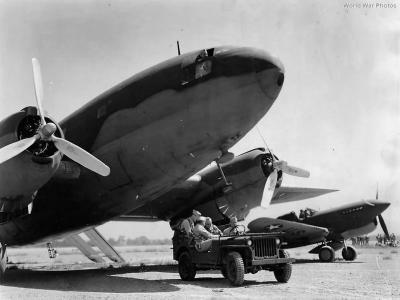 Jeep beside C-46 Commando and P-40 Warhawk