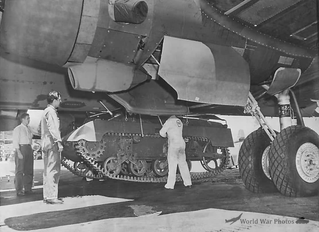 Loading T9 Tank onto Rack Under Belly of C-54 1945