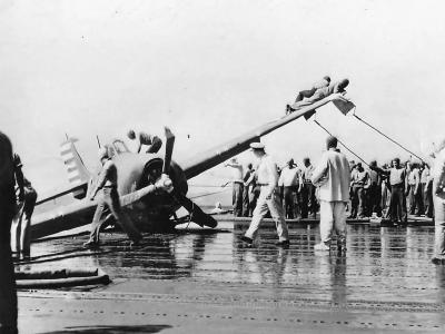 Crew aboard Aircraft Carrier Work to Right Crashed Wildcat 1942