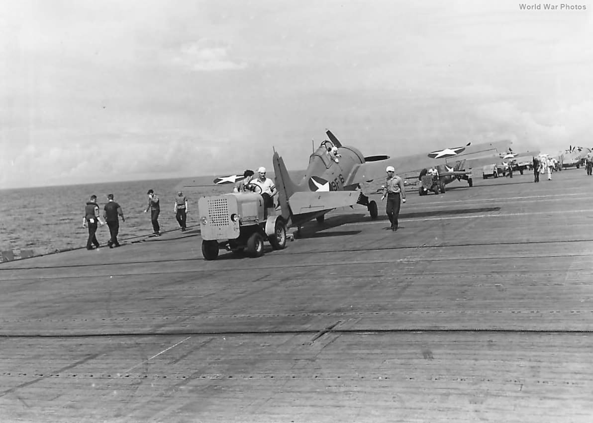 Hebard A14 tug hauls F4F of the VF-9 into position on carrier 42