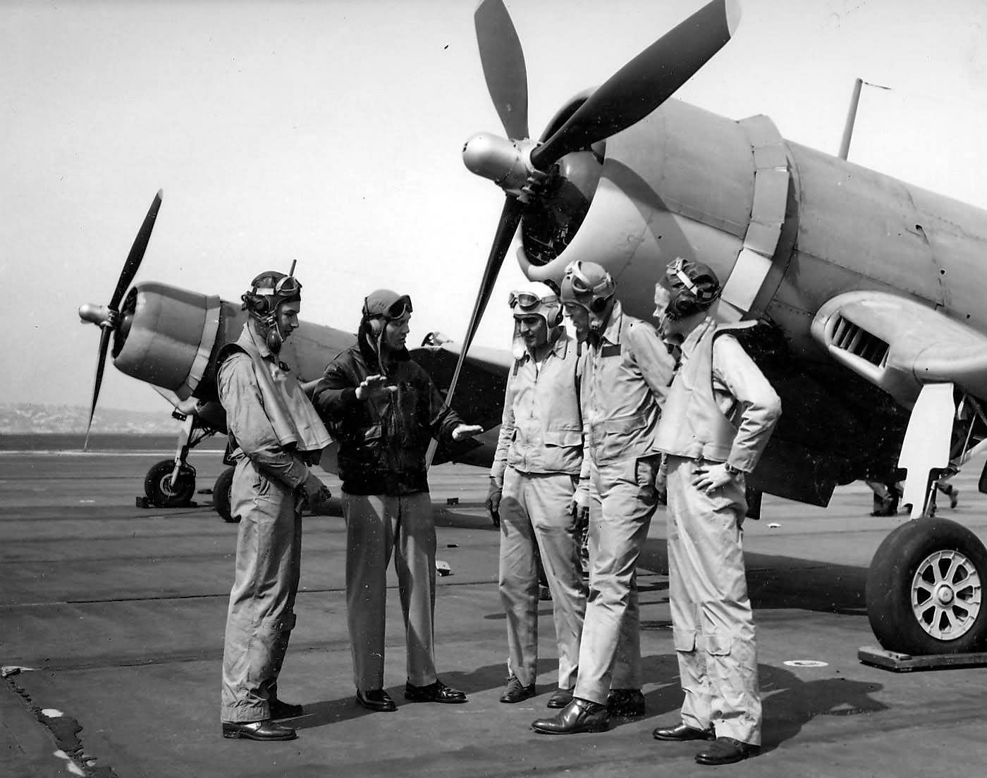 LtCdr Joseph Clifton and pilots of VF-12 stand in front of F4U-1 Corsair 1943