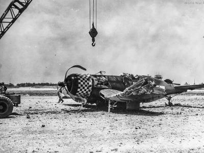 Marine F4U of the VMF-312 wreck at Kadena May 1945