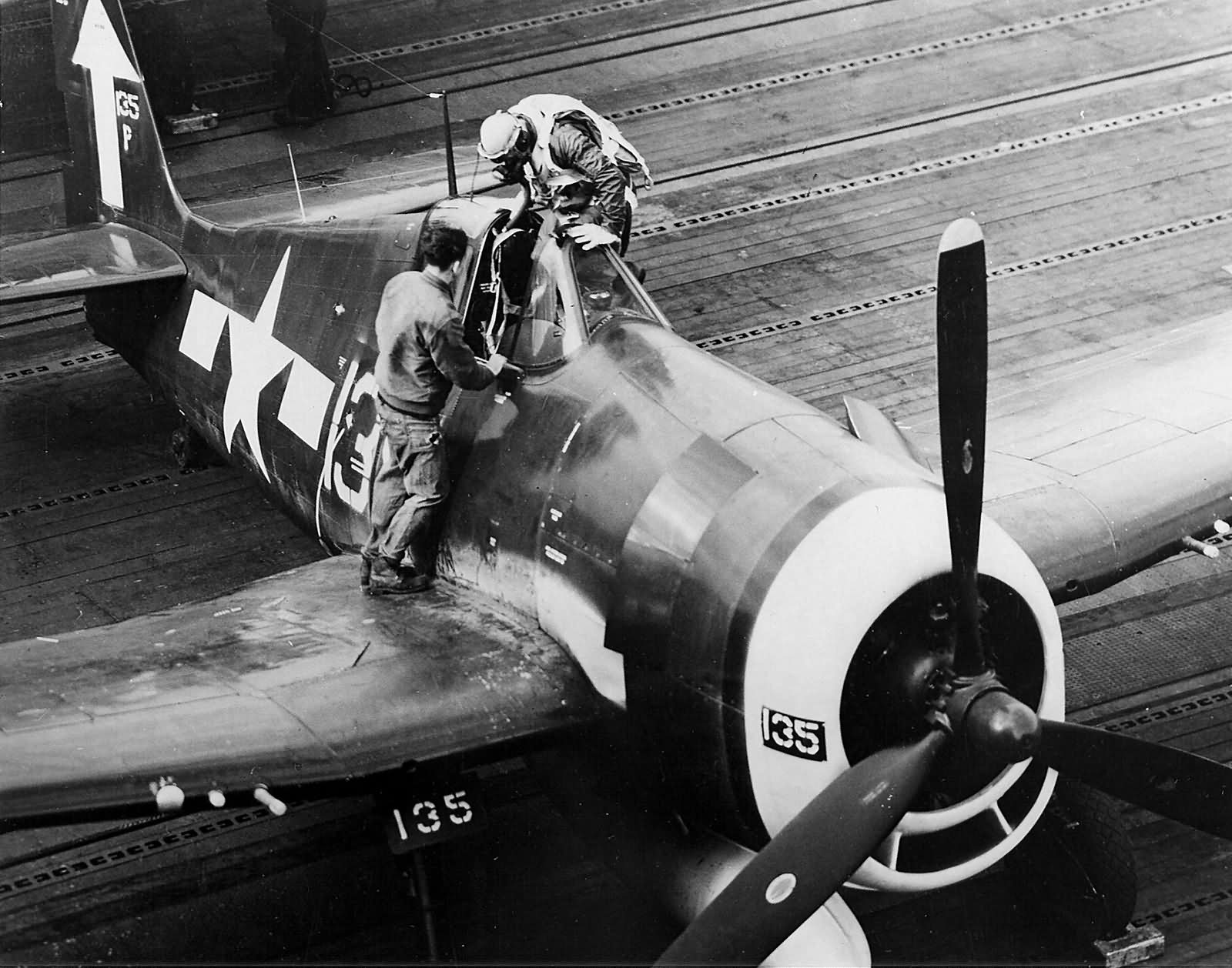 F6F-5P Hellcat #135 of VF-84 on the flight deck of the aircraft carrier Bunker Hill (CV-17) February 19, 1945 Iwo Jima