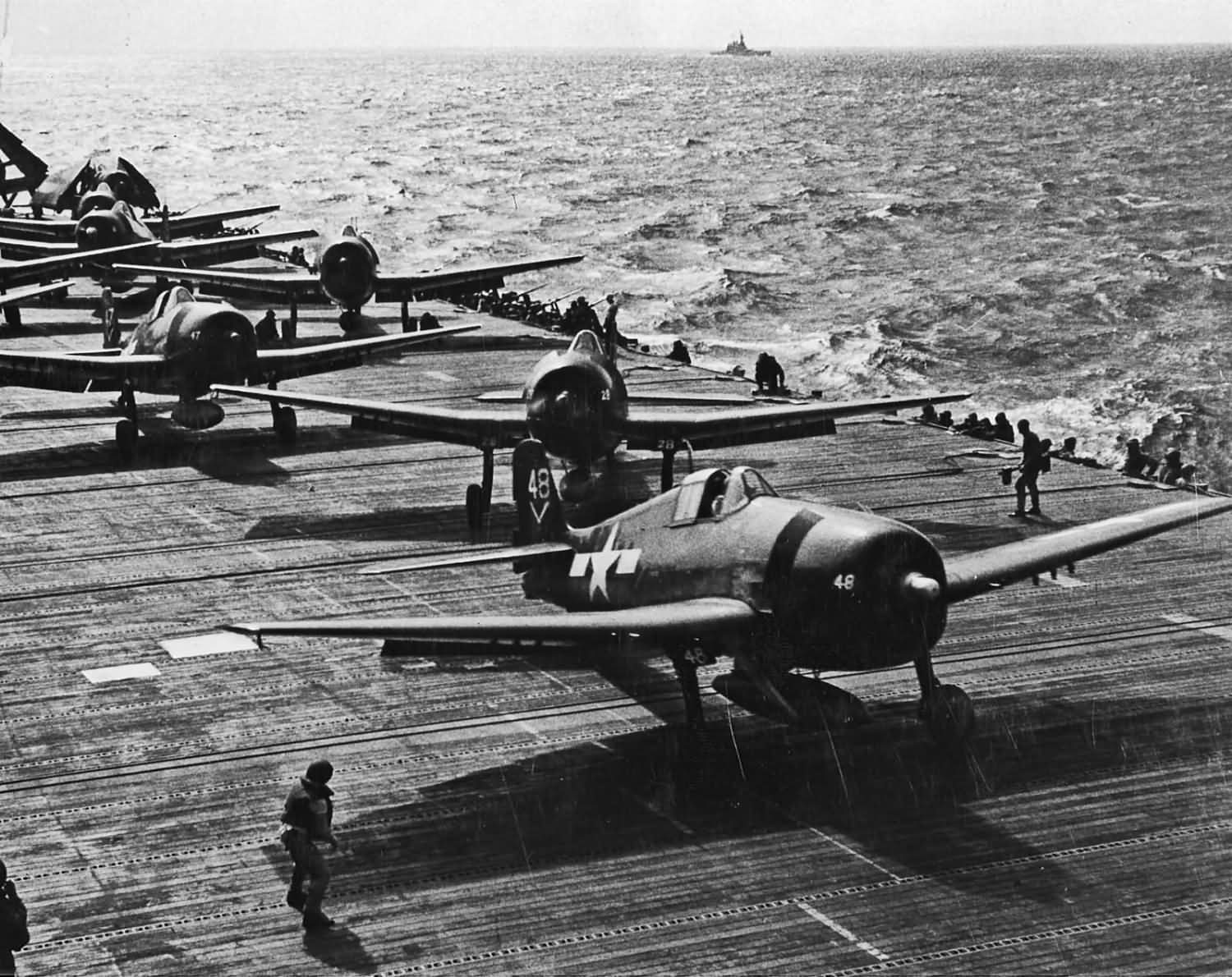 F6F-5 Hellcats of VF-80 prepare to launch from the aircraft carrier Ticonderoga CV-14 November 6, 1944. Hellcat #48 in foreground