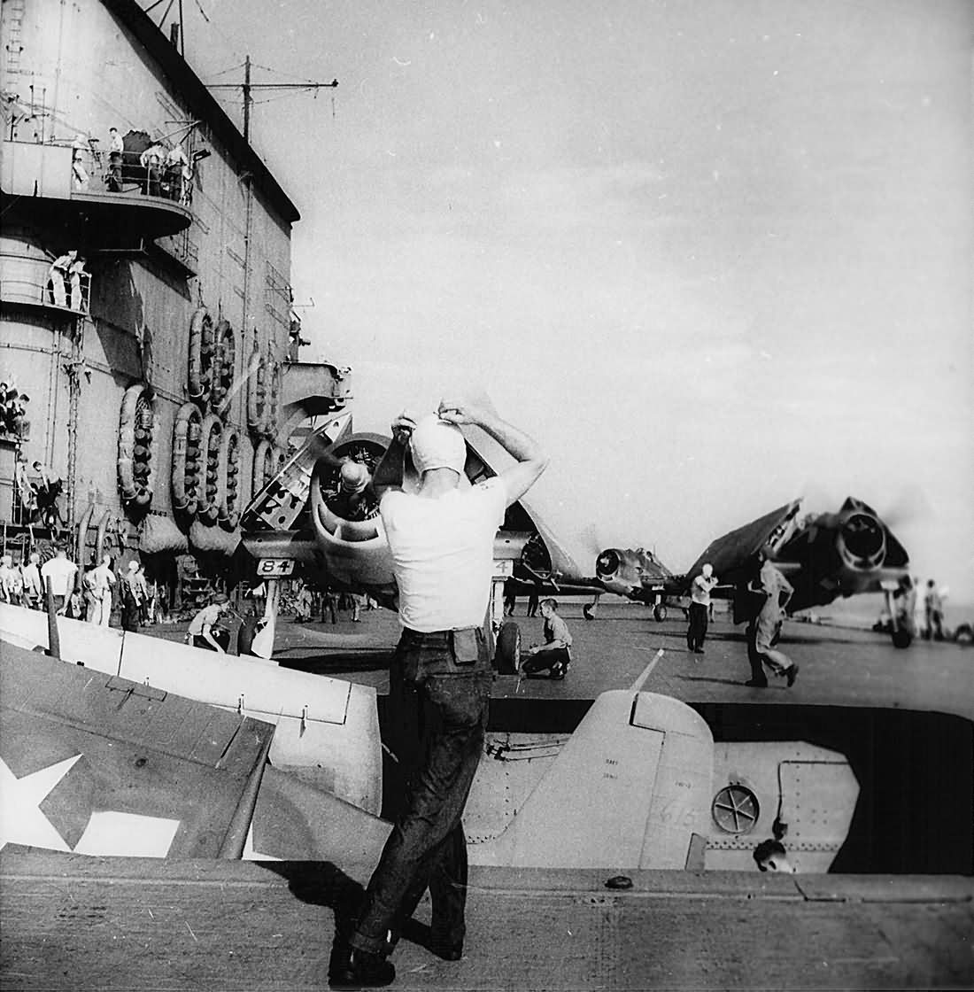 F6F Hellcat of VF-12 descends to the hangar deck on an aircraft elevator on board the carrier Saratoga CV-3 January 18, 1944