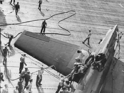 Pilot Helped from Crashed Hellcat 1944