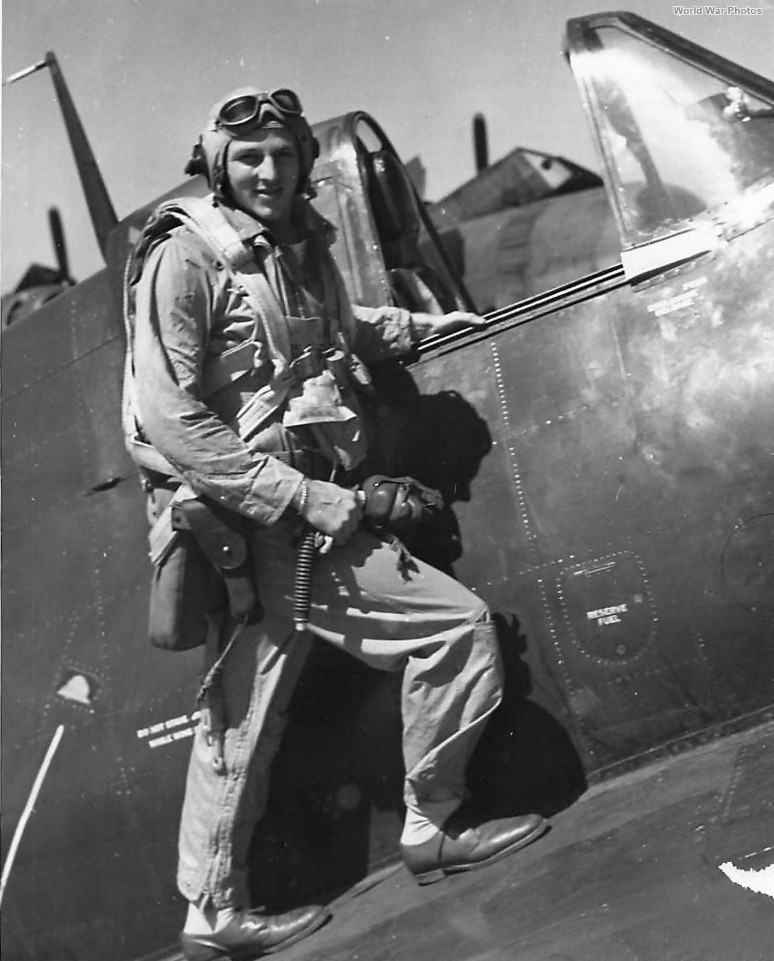 Ace James Bryce of VF-22 on wing of his F6F ’45