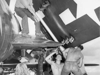 Installing rockets on F6F-5 on board USS Essex