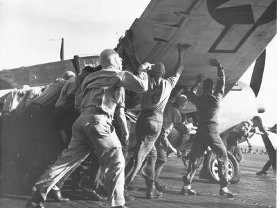 Moving a damaged F6F, USS Lexington 1943