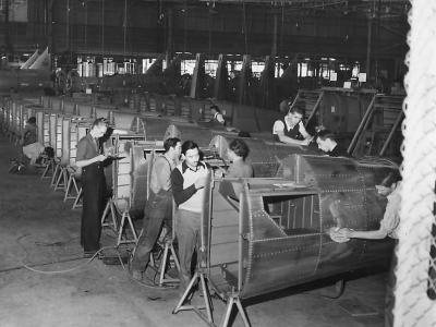 Workmen assembling fuselages of O-47B