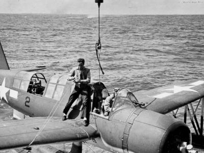 OS2U being hoisted on board