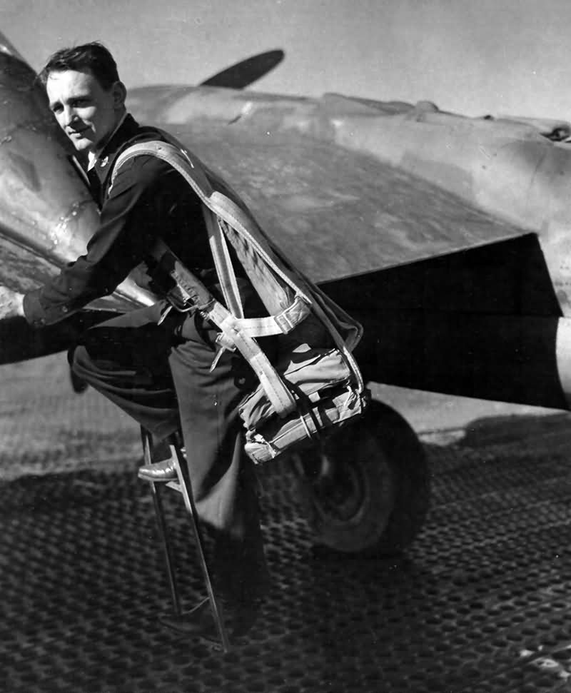 A Pilot Of the 94th Fighter Squadron 1st Fighter Group Climbs Into the Cockpit Of His P-38 Lightning Italy