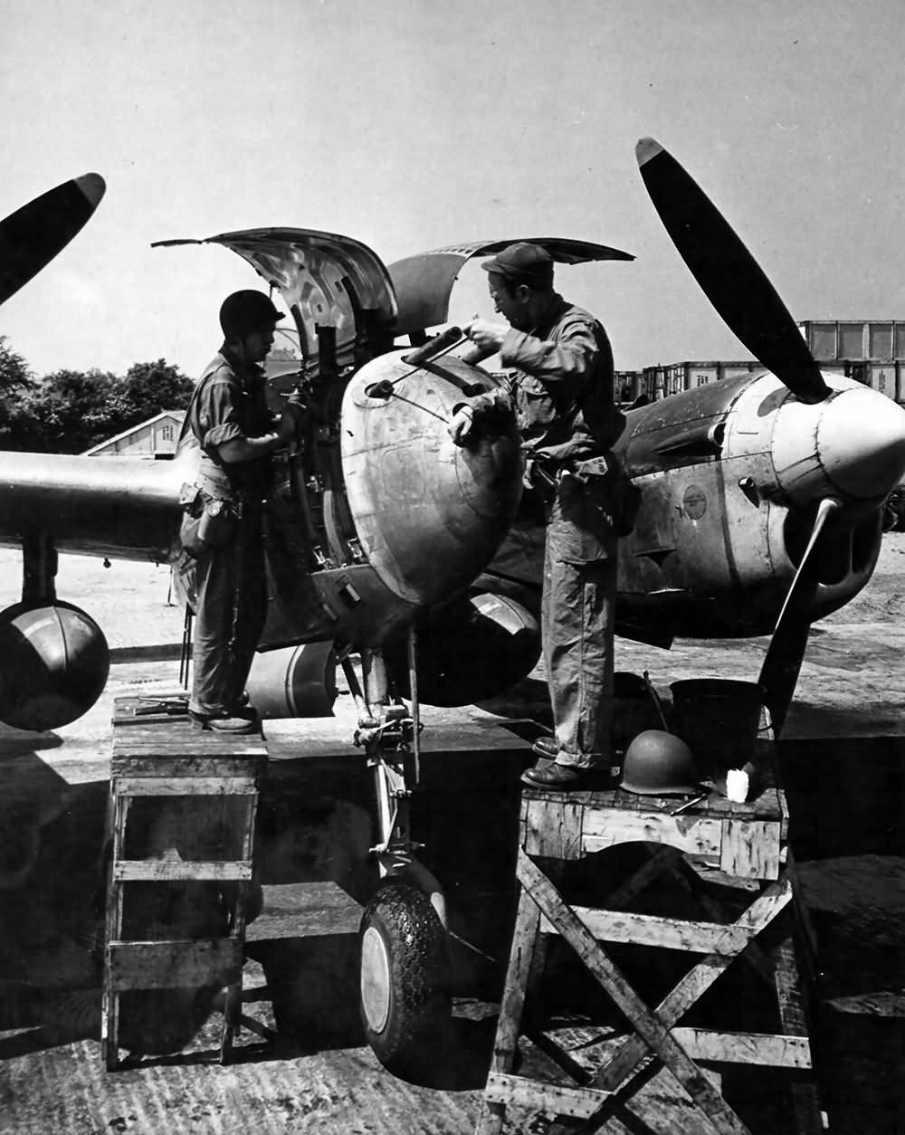 Ground crew members working on a P-38 Lightning England