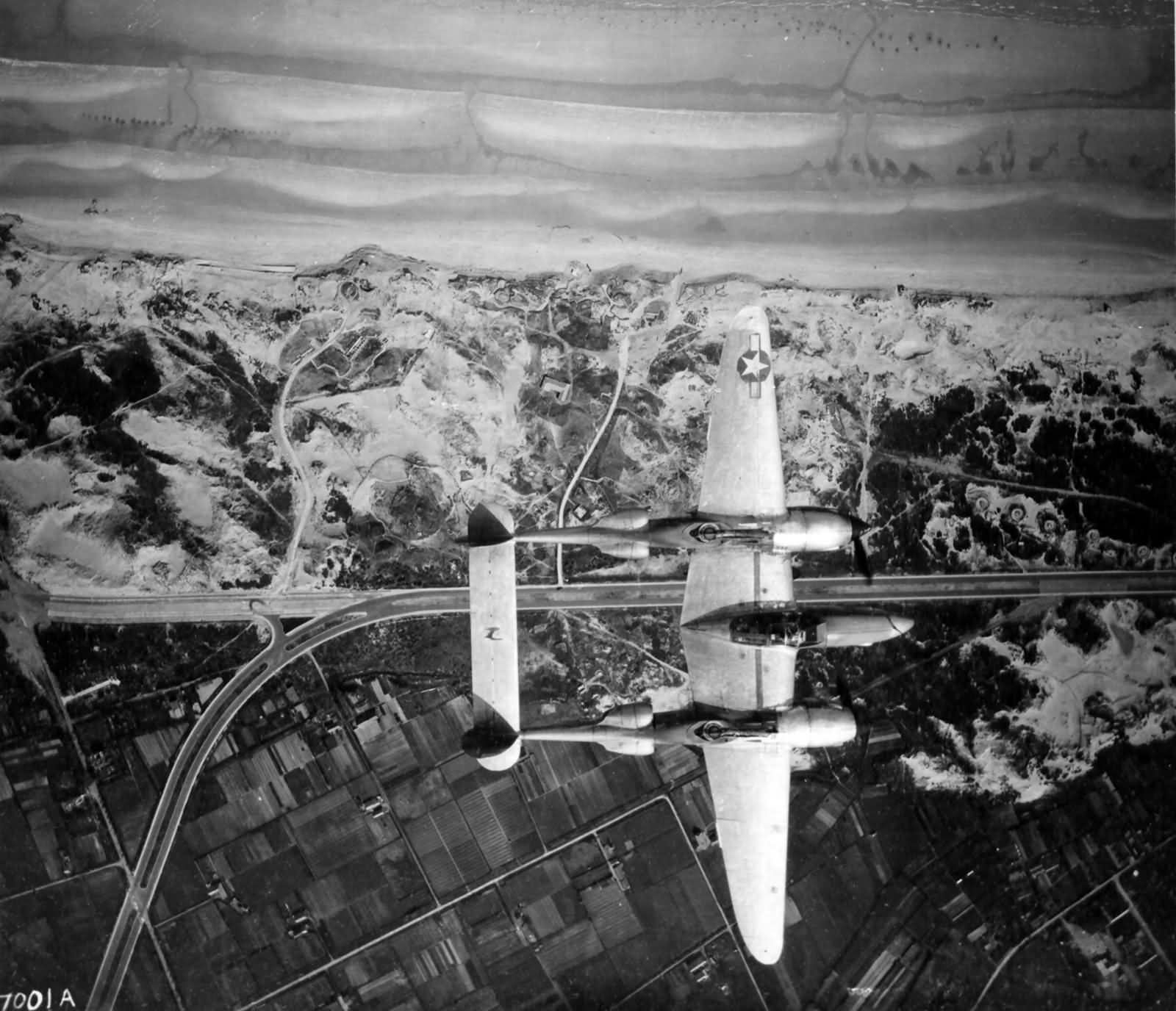 Lockheed P-38 Lightning Flies Over A Coast Line Near Ostend Belgium May 1945