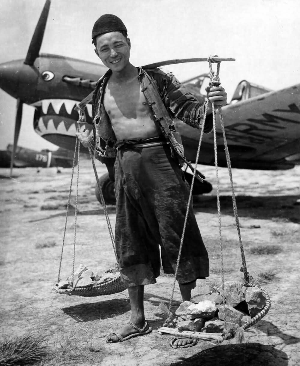 A Chinese Carrying Rock For The Construction Of A Field Of The 14th Air Force In China