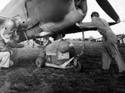 Ground Crewmen Ready To Load A 500 Lb Bomb Under The Belly a P-40 of the 79th Fighter Group Capodichino Italy
