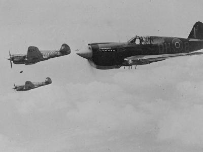 Three Curtiss P-40 Kittyhawk aircraft in flight RNZAF