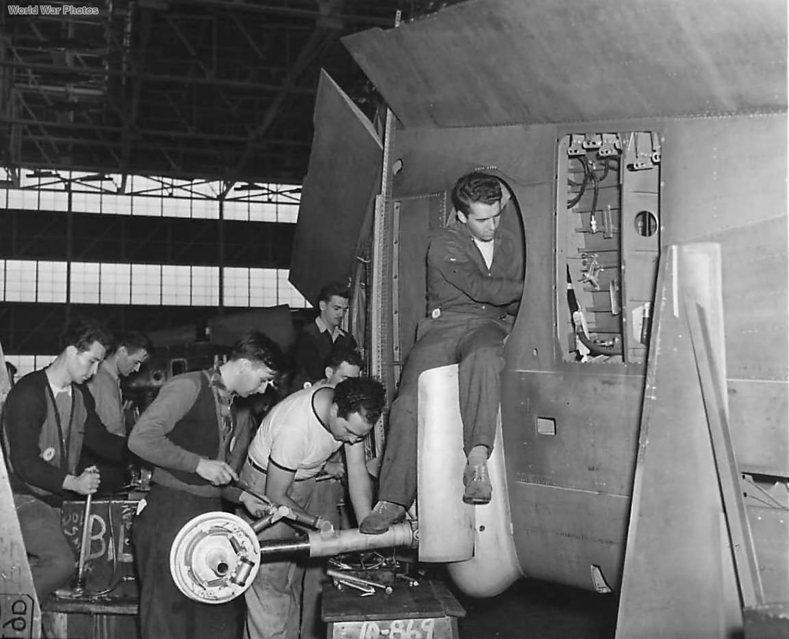 Employees at Curtiss-Wright working on P-40 landing gear ’41