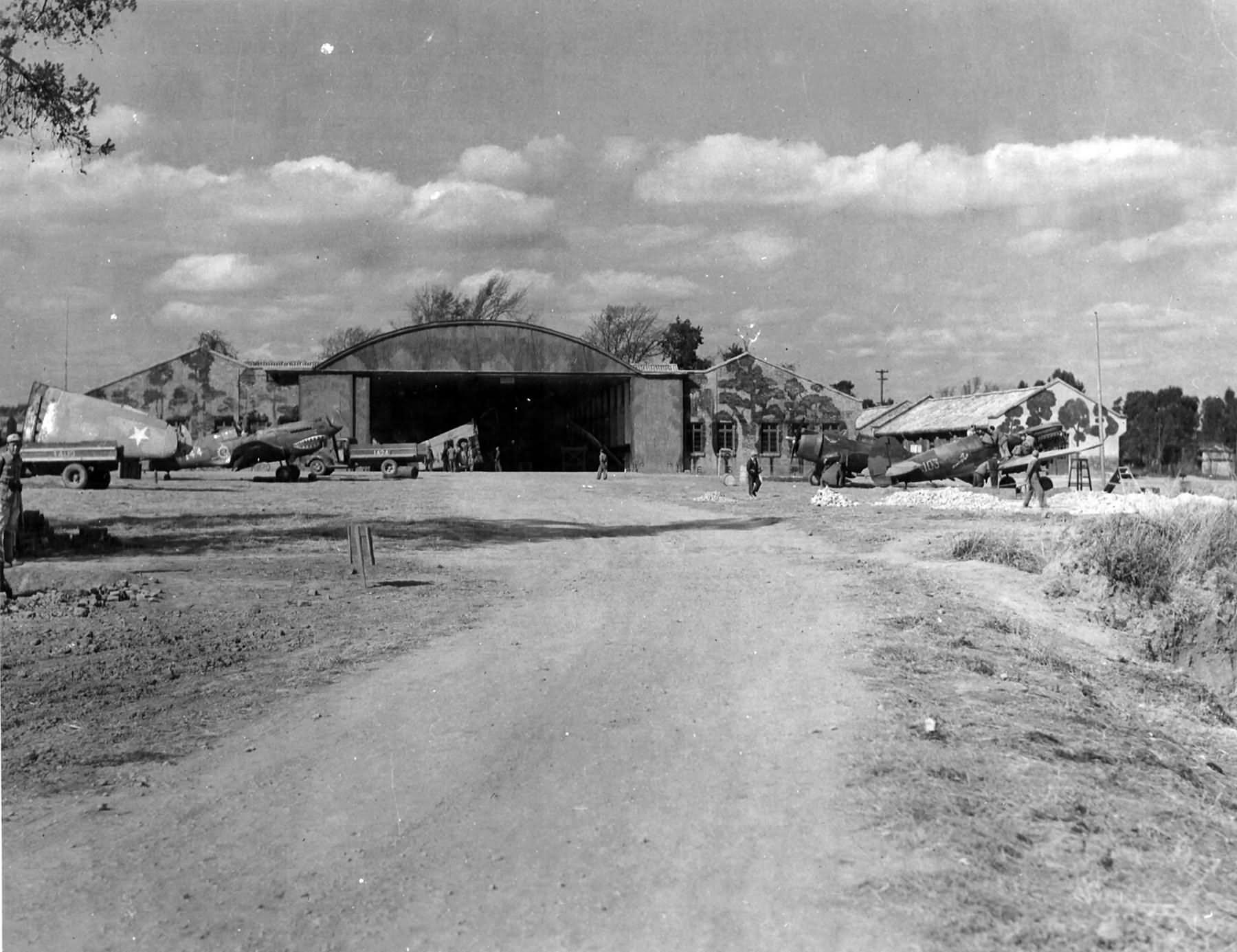 P-40K #103 of the 76th FS, 23rd Fighter Group and P-43A in background