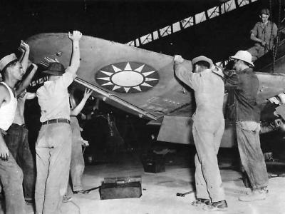 U.S. ground crew completes the wing assembly on a P-43 Lancer for the Chinese Air Force, 1942