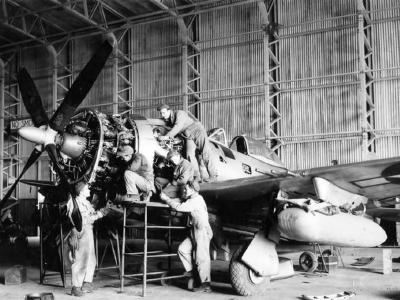 Ground crew of the 56th FG work on the engine of a P-47 Thunderbolt at Boxted February 1945