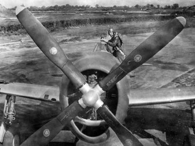 Major Robert S. Johnson ace pilot of the 61st FS, 56th Fighter Group poses with a P-47