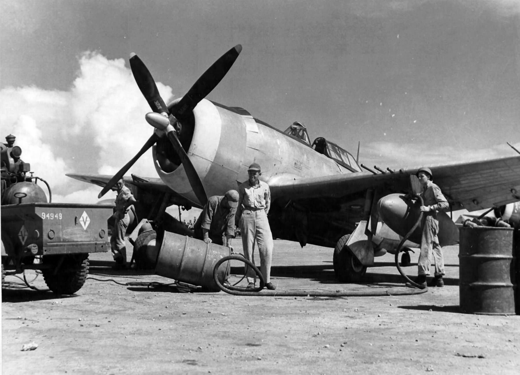 Mechanics of the 333rd Fighter Squadron, 318th Fighter Group Force napalm into 165 gallon fuel tank of P-47