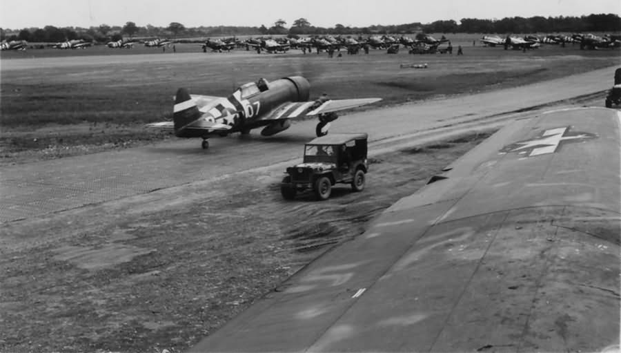 P-47 Thunderbolts of the 406th Fighter Group line up for take off before a mission