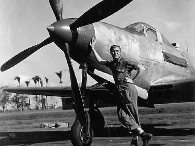 Airman posed by a P-63