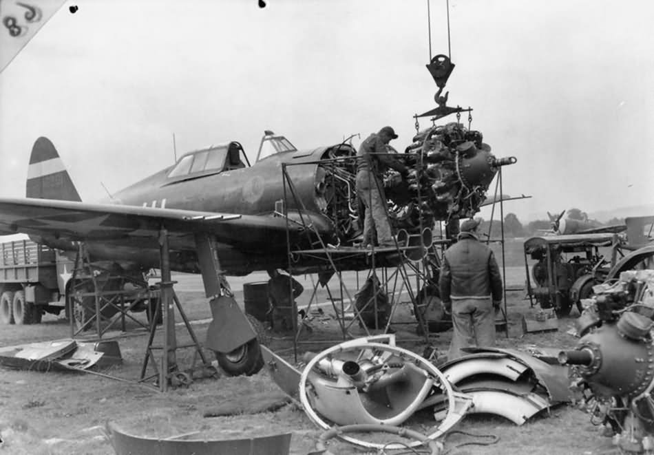 mechanics removing the engine from a P-47 at Duxford September 1943