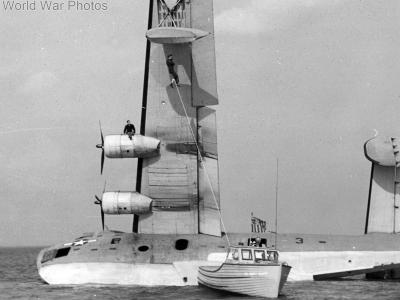 Coast Guard small craft supports efforts to right a PB2Y