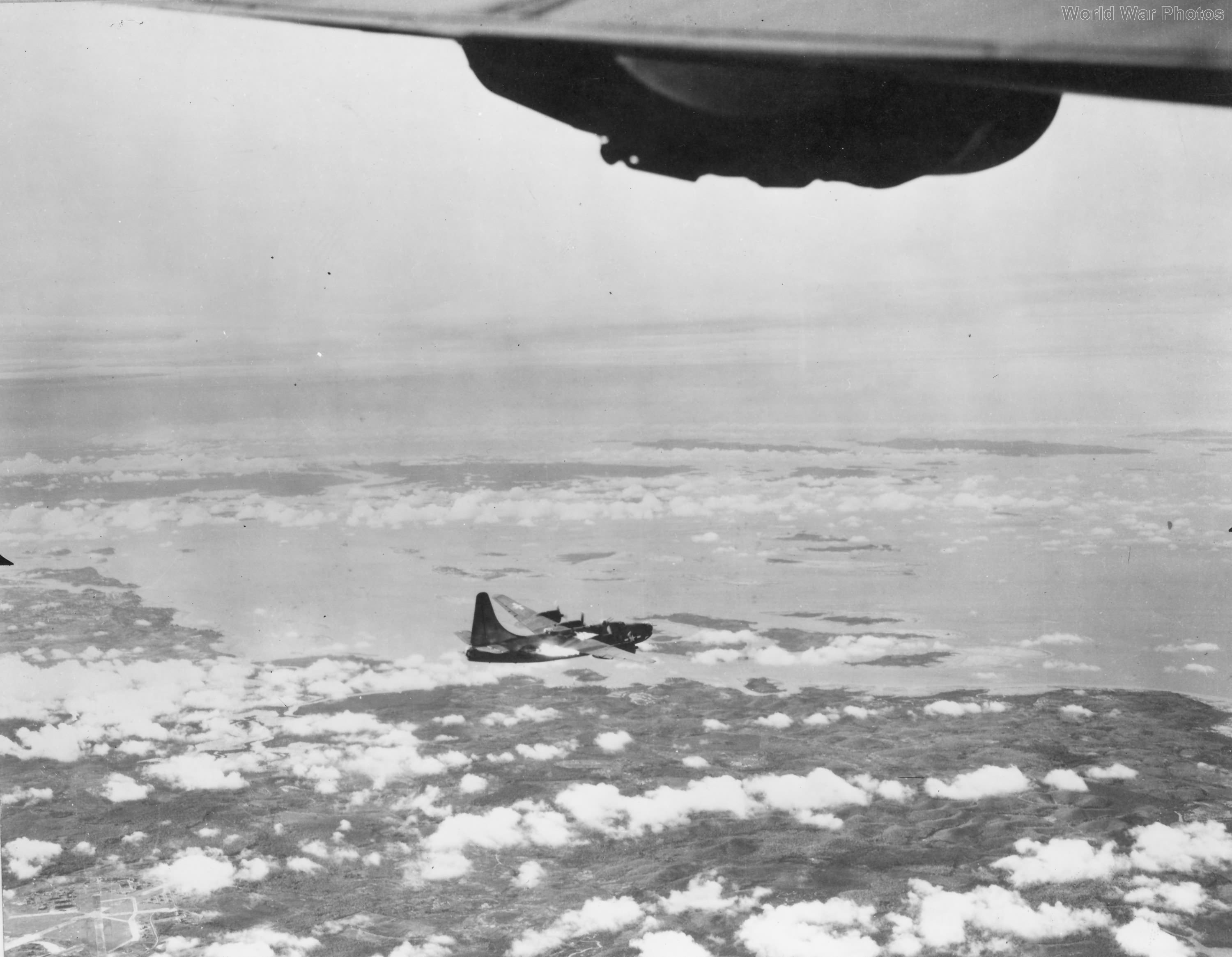 Burning PB4Y-2 of VPB-106 over Singapore June 1945 3
