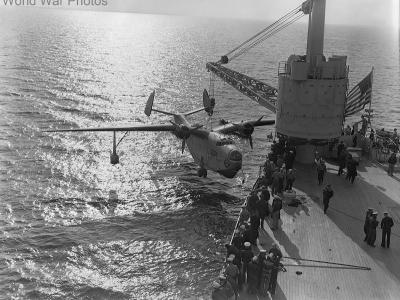 PBM-1 of the VP55 being hoisted on board the seaplane tender