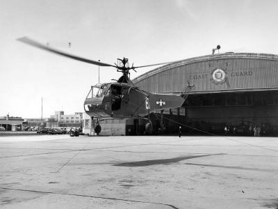 HNS-1 releasing wire from a rescue hoist while flying around CGAS Brooklyn 1 June 1944
