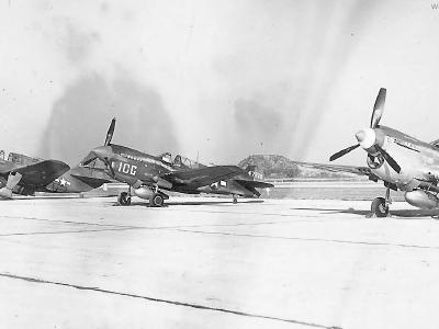 P-40 parked by A-25