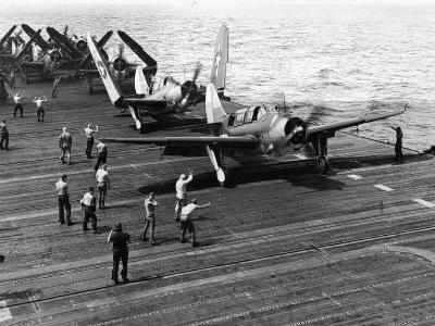 SB2C-3 Helldiver of VB-20 preparing to take off from the flight deck of USS Enterprise (CV-6)